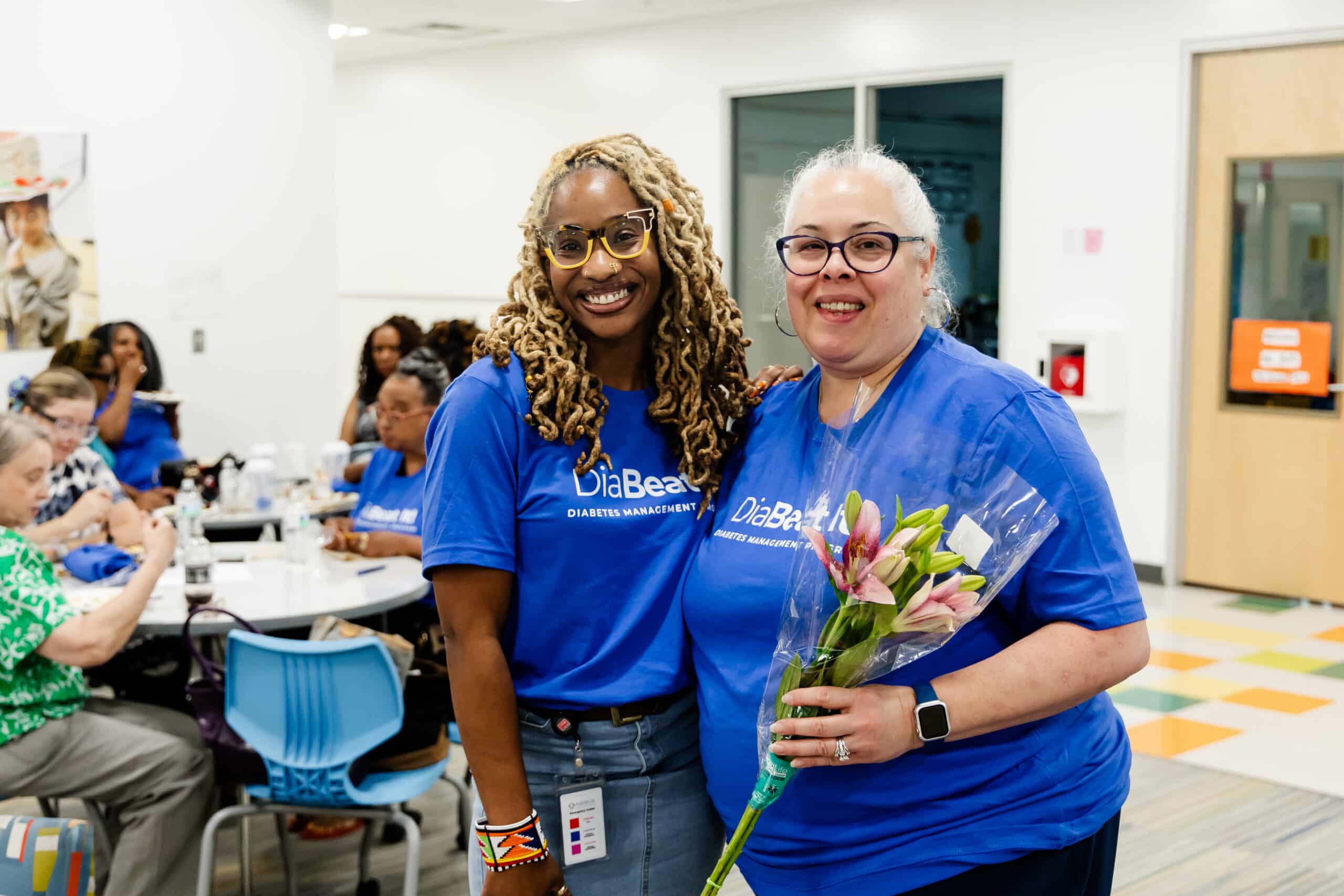 Two male pharmacists speaking with each other